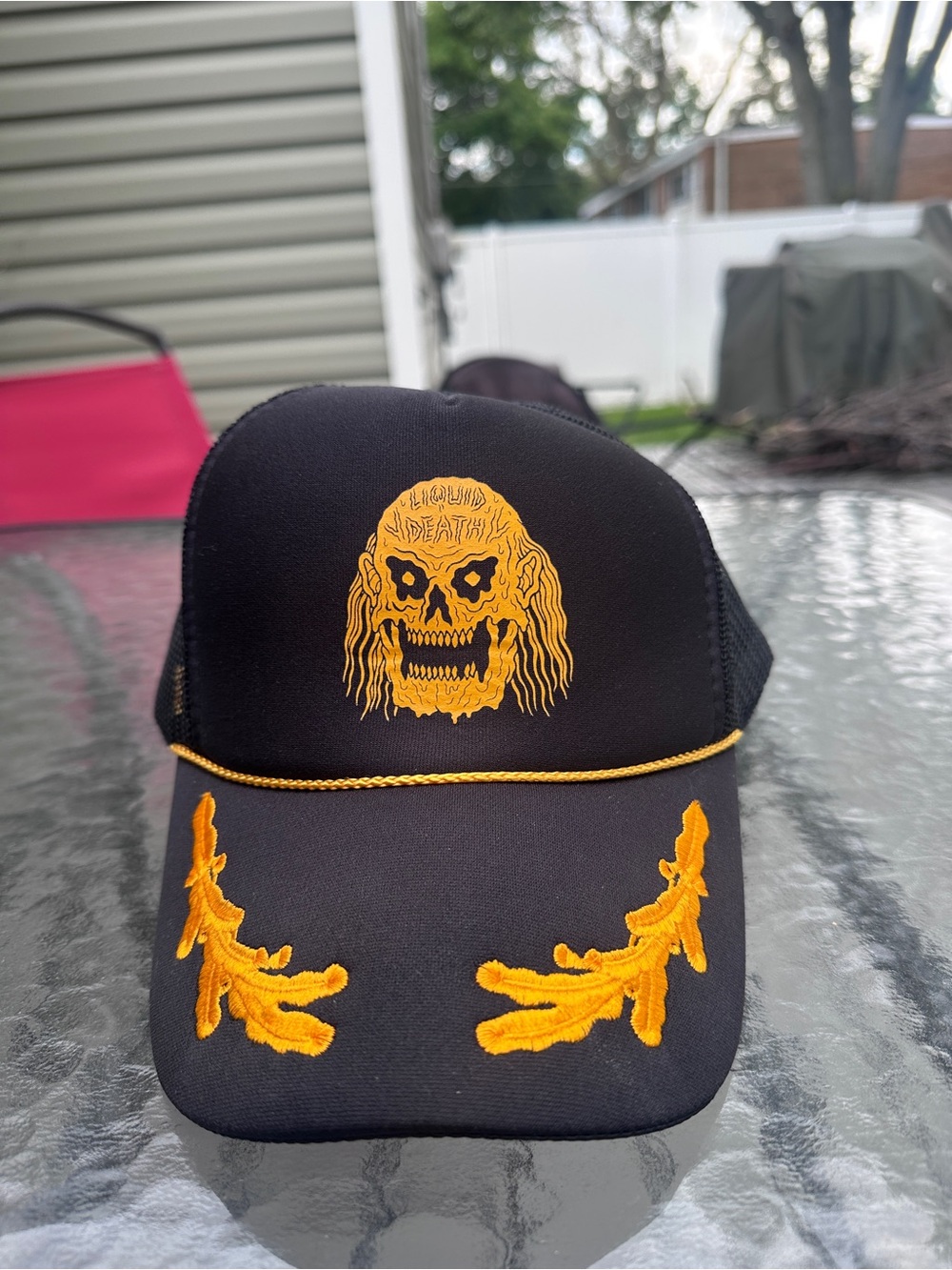 Liquid Death Trucker Hat Yellow Skull
